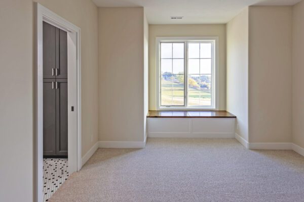 bedroom with casement windows overlooking valley