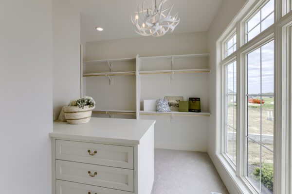 Master closet with Pella window with grilles between the glass