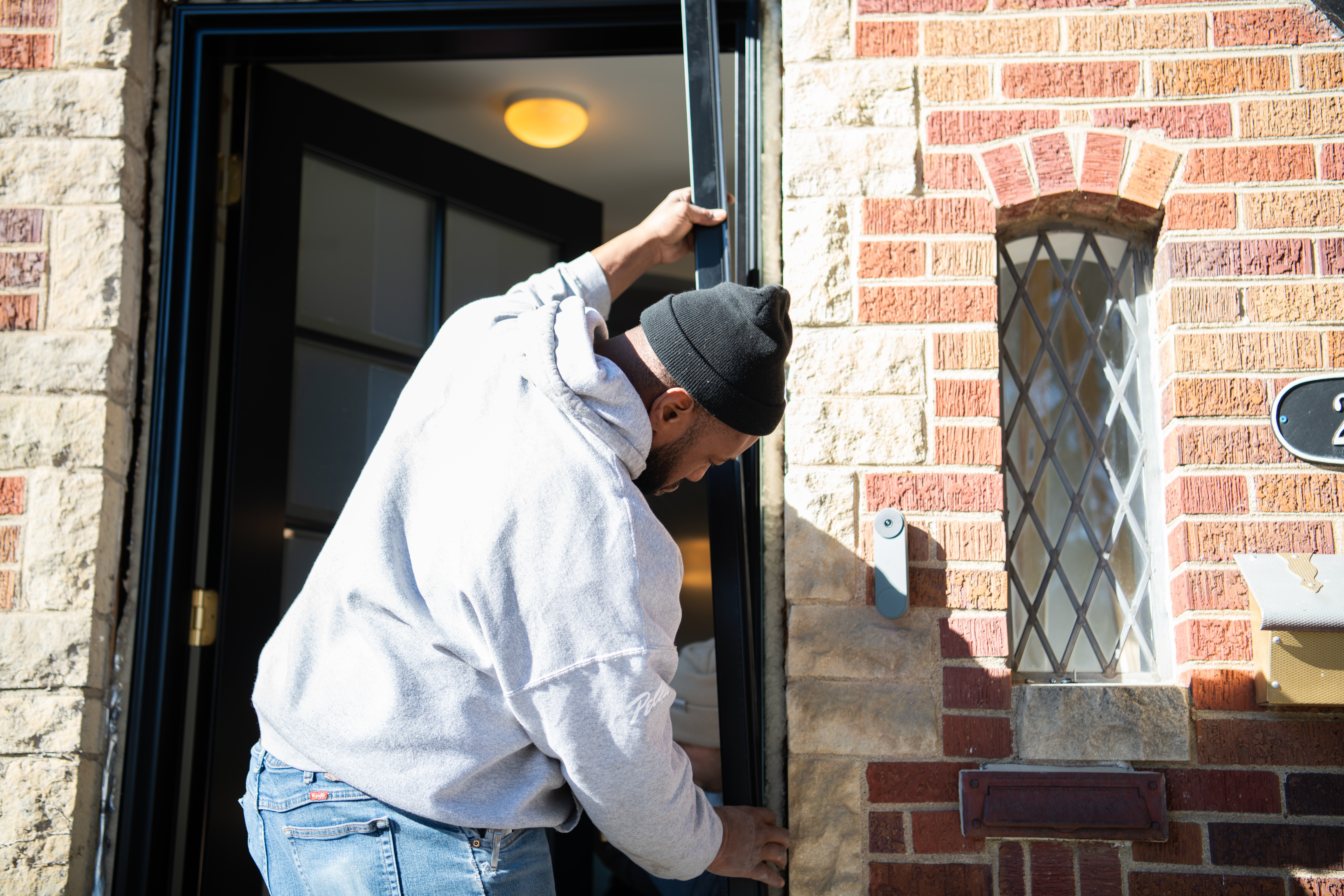 Expert Pella installer during entry door installation