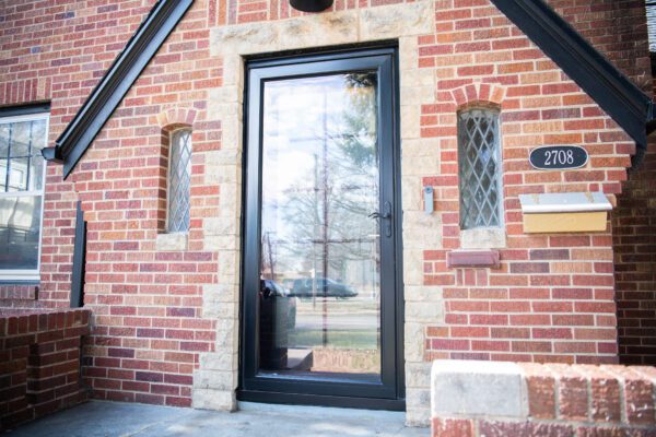 Black Pella Reserve entry door storm door