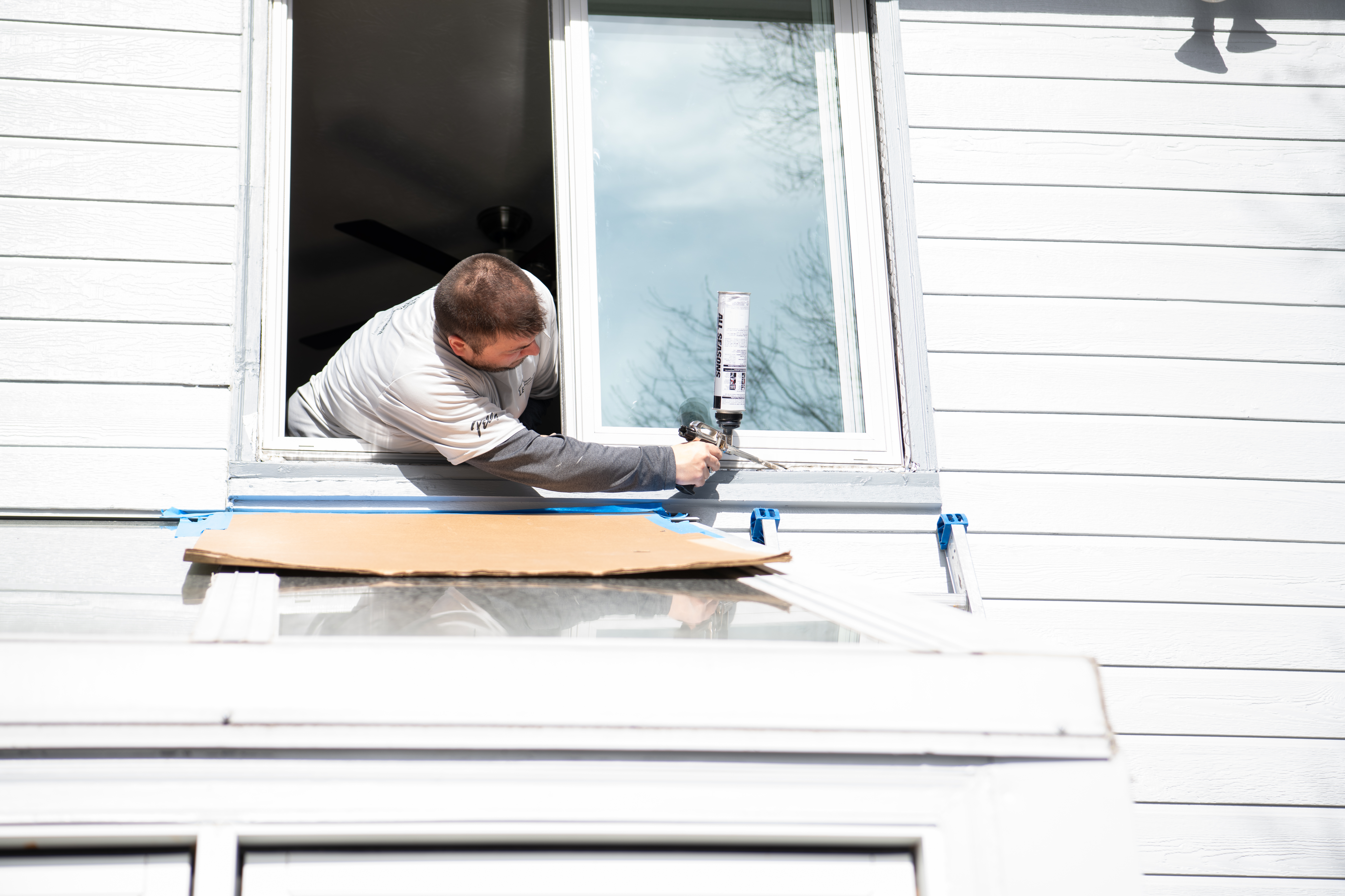 Pella expert installing Impervia sliding window