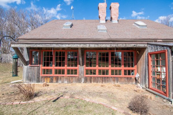 Replacement windows on rustic home with grilles