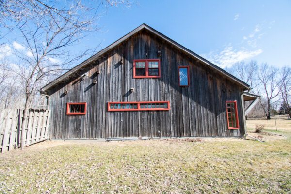 Red Pella Reserve replacement windows on rustic home