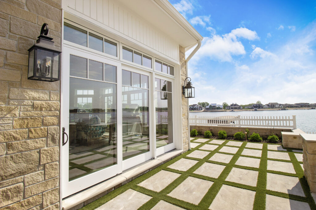 White sliding patio door out to lake