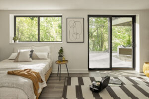 Black sliding window In white bedroom