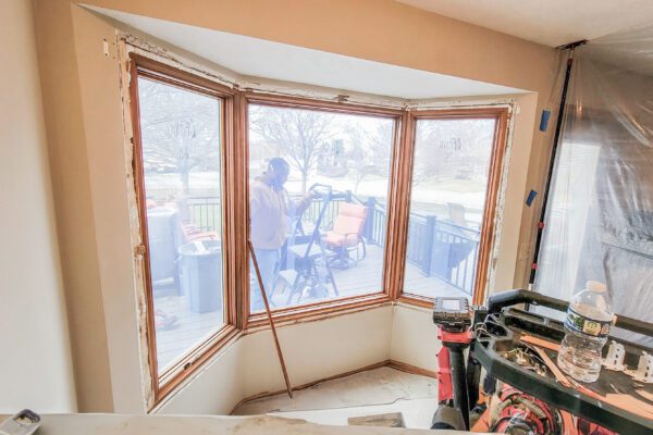 Wood by window during installation process