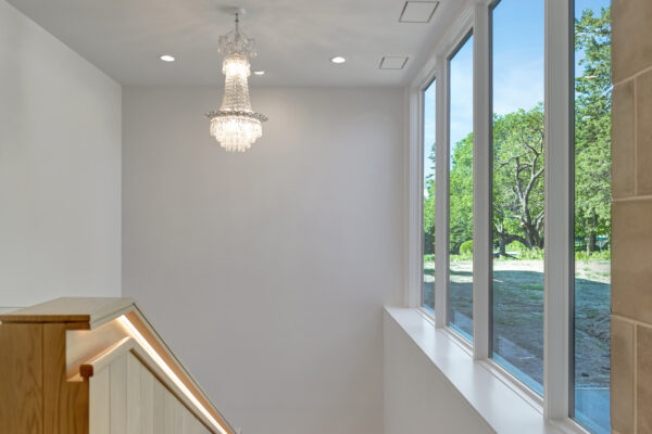 Staircase to basement with windows