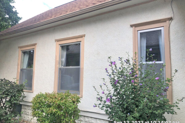 Before exterior view of double hung windows that needed replaced