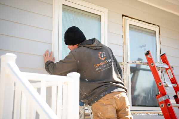 Pella installer installing window