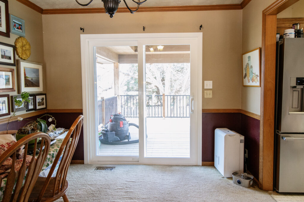 Dining room vinyl sliding patio door to deck