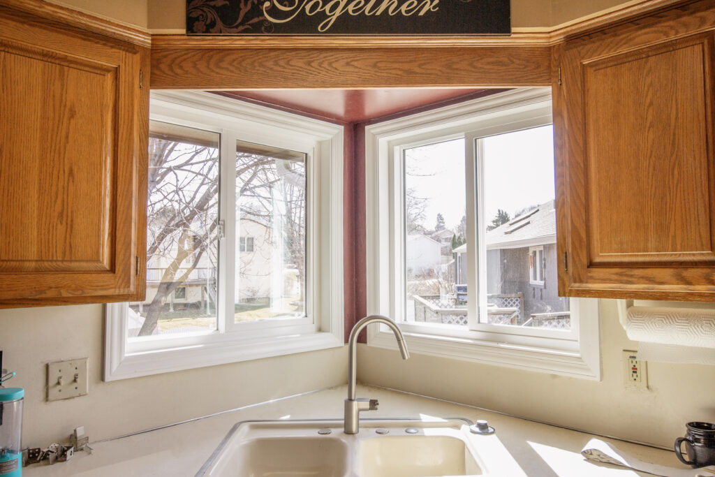 Kitchen vinyl sliding windows above the sink