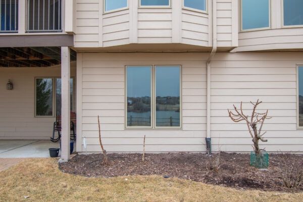 Tan Pella Double Casement Window on exterior