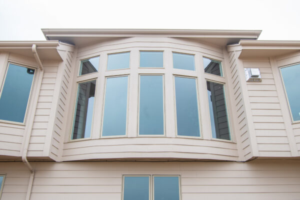 Tan Pella Bow Window on exterior