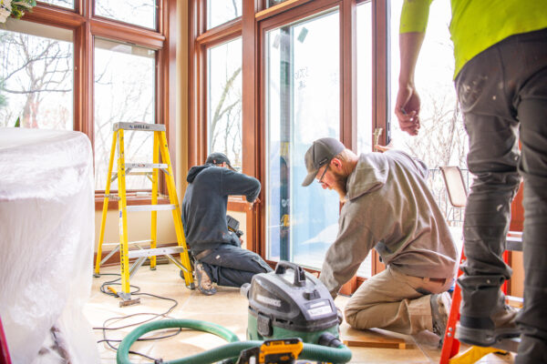 Installers cleaning up after installation