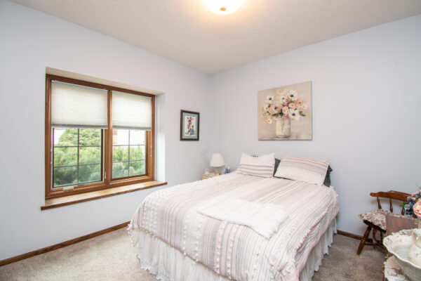 Interior Pella Lifestyle wood windows in bedroom