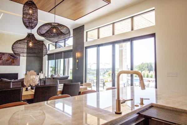 Black Pella Lifestyle Multi-slide patio door to pool