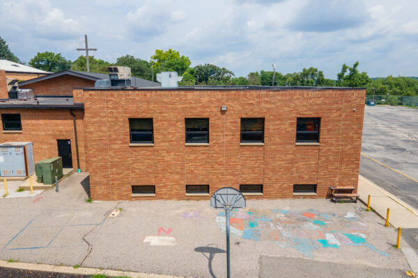 Brick exterior with black Pella replacement windows