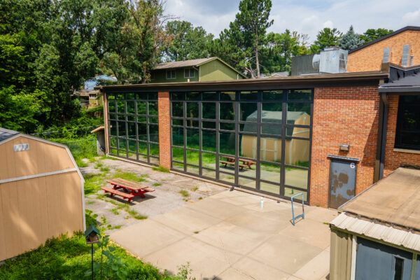 Exterior view black Pella Reserve contemporary windows
