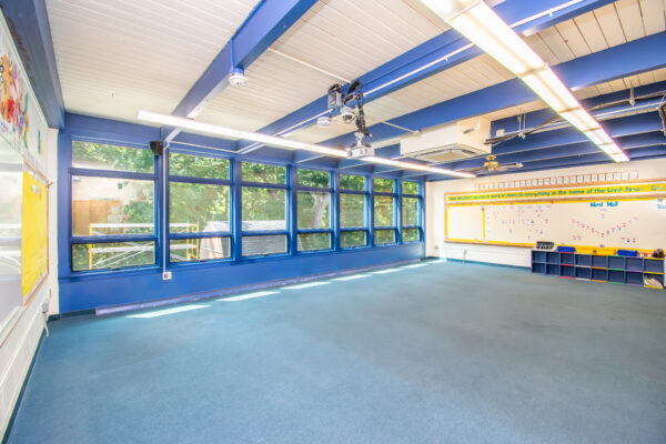 Interior view blue Pella replacement windows in classroom