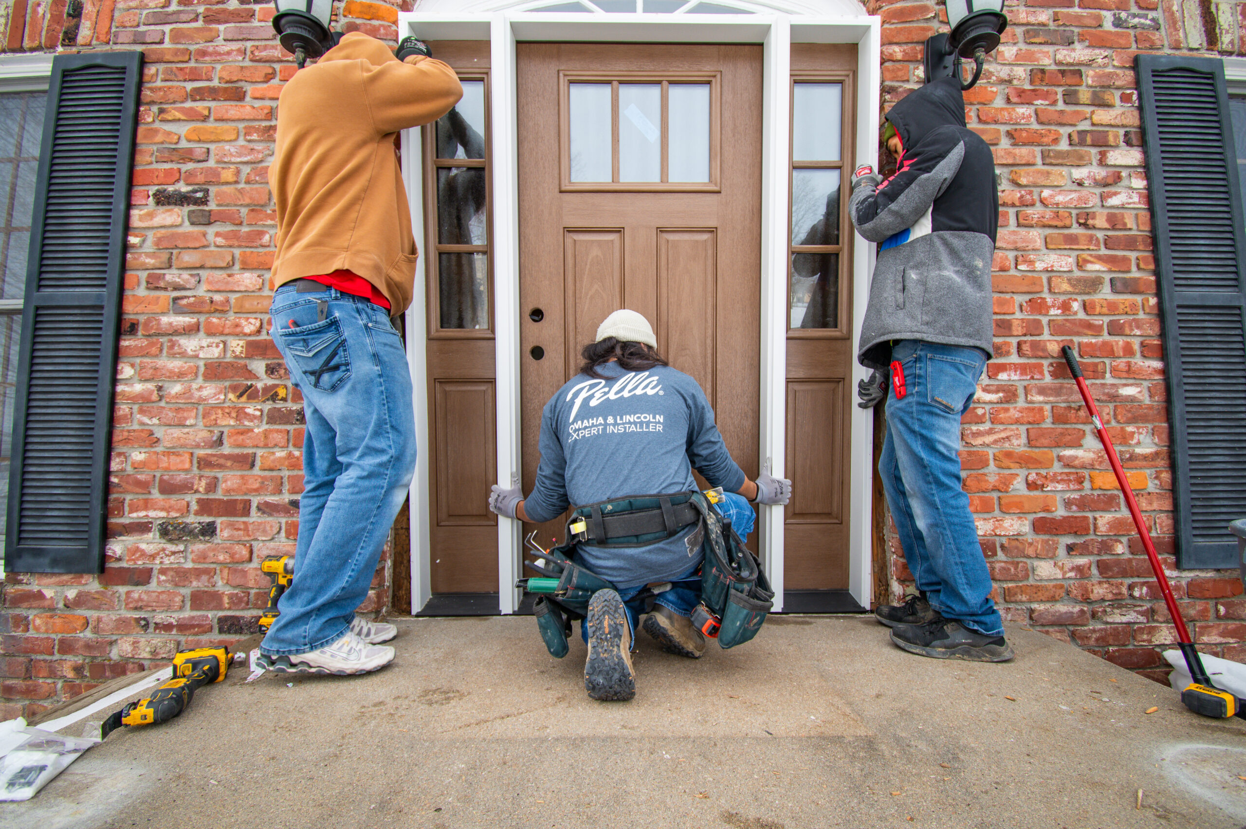 Pella experts installing front entry door